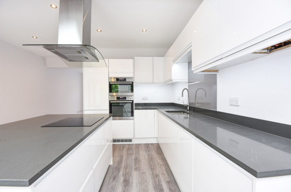 House conversion for rental | Kitchen - black quartz work surface | Interior Designers